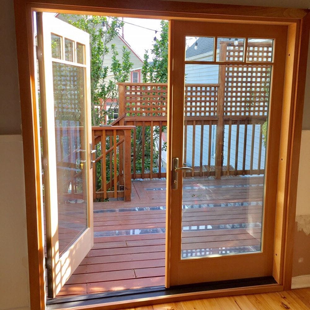 Wood framedd French patio door opening to a deck
