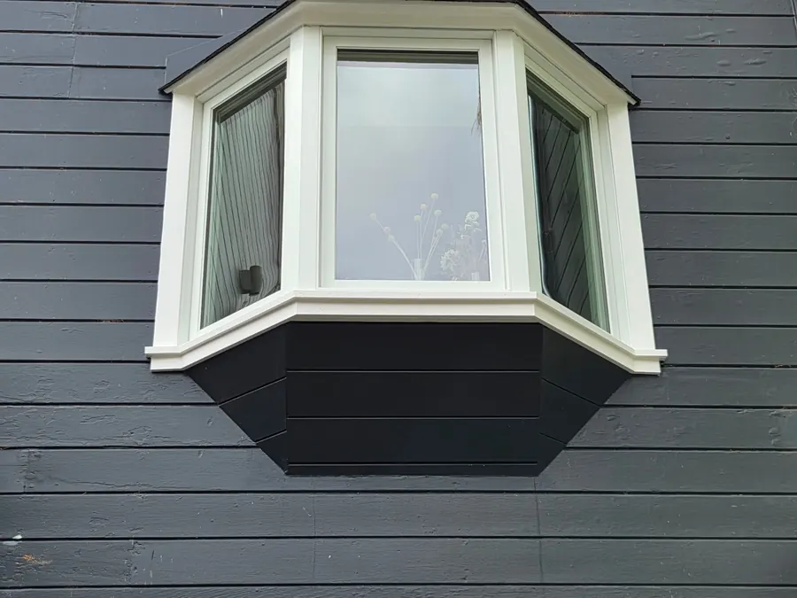 New bay window above French doors on dark lap siding, San Carlos, CA