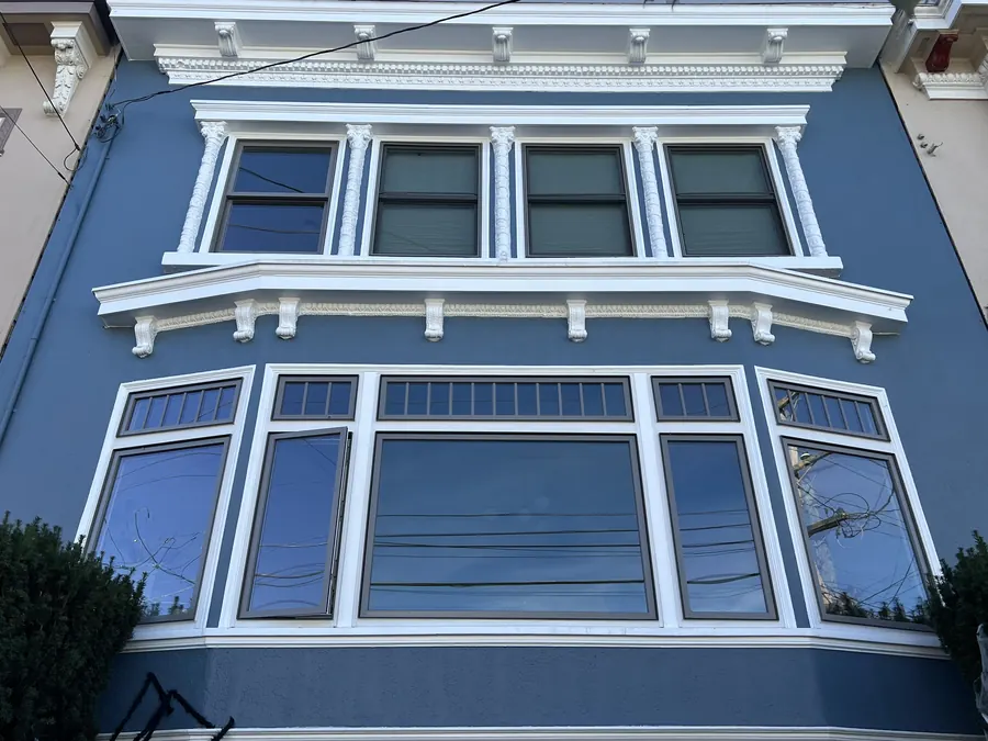 Blue Edwardian facade with a full set of new white windows