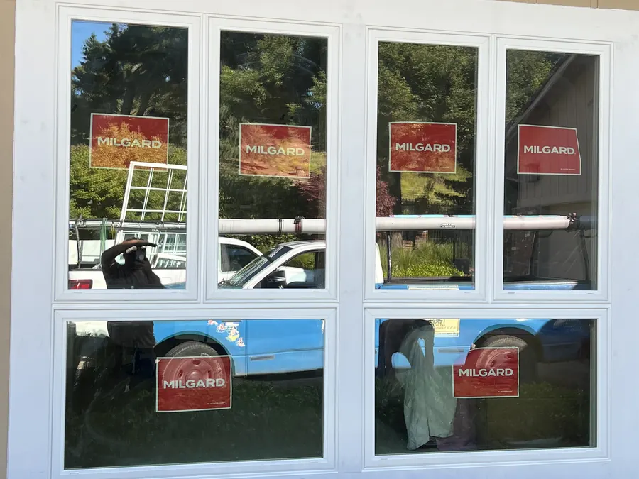 Eight-panel white window wall with new Milgard units, Palo Alto, CA