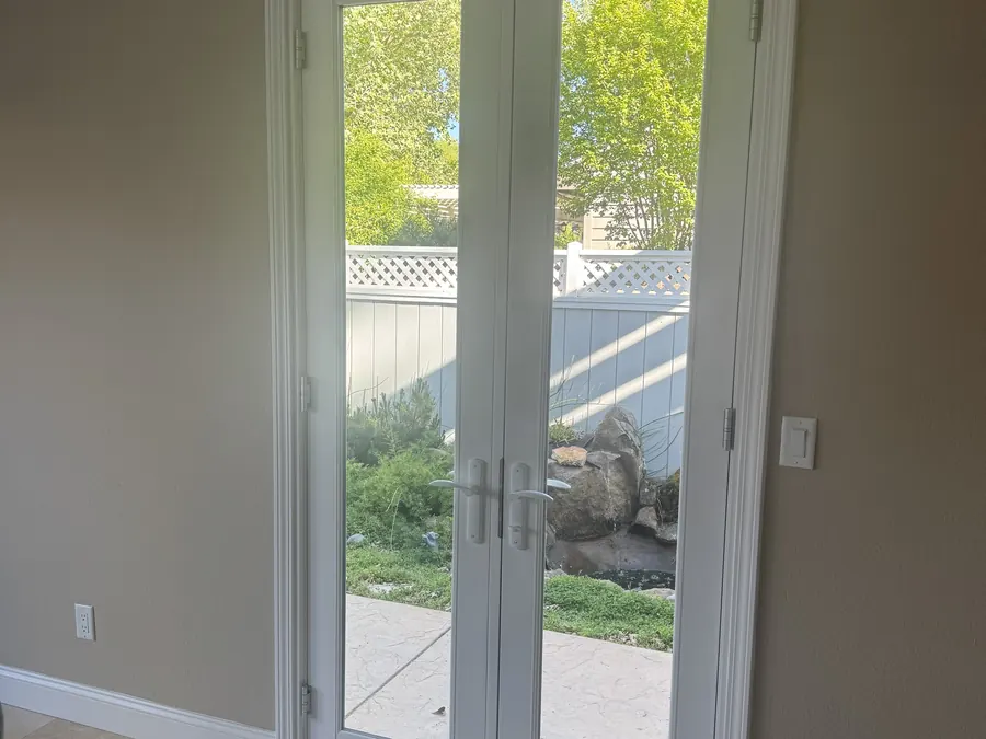 Bright interior view of new white French doors, Palo Alto, CA