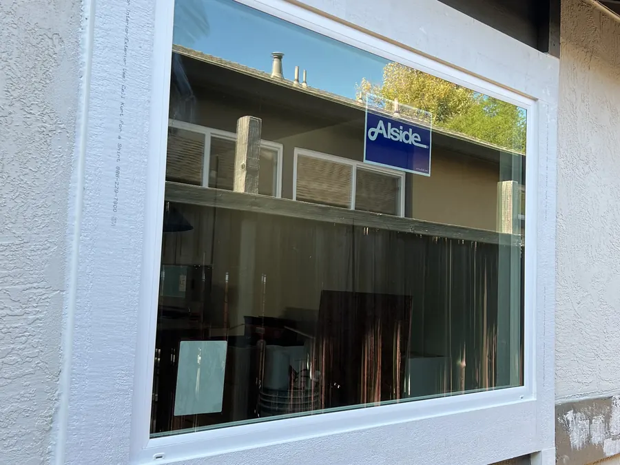 Wide new picture window with fresh white trim, San Carlos, CA