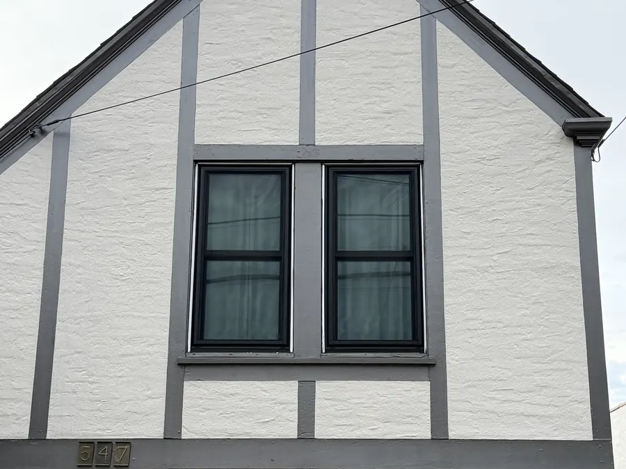 Tudor-style gable with new black windows, San Mateo, CA