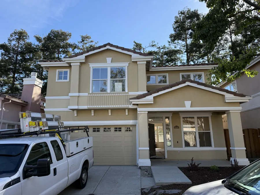 Two-story home after a whole-house window replacement, San Mateo, CA