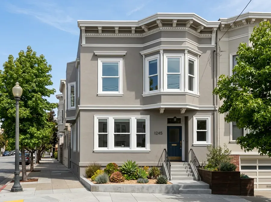 Professional window installer fitting a new window in a Bay Area home